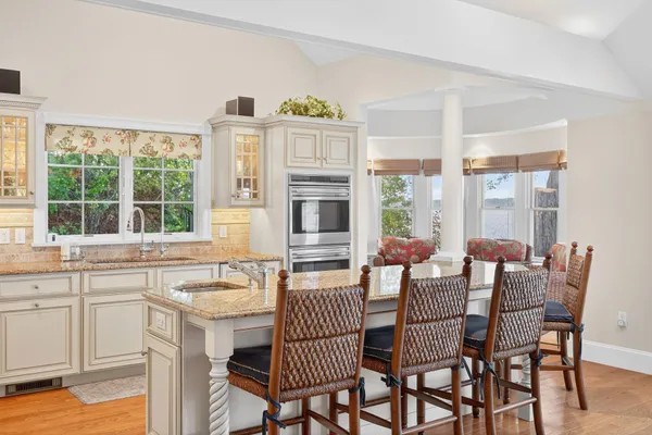 a kitchen with cabinets and window