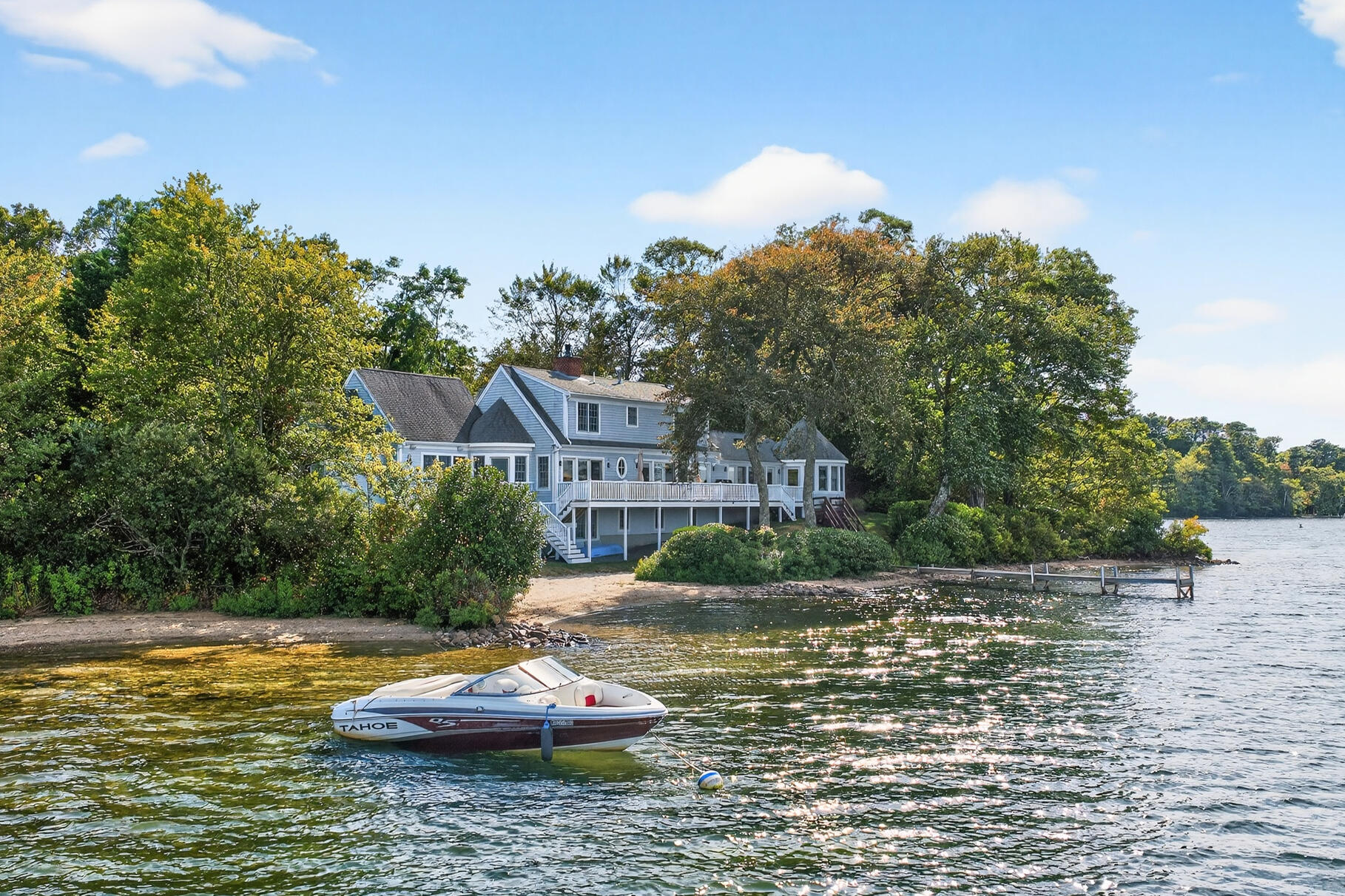 10 Brian Way Harwich, MA 02645 - Photo 56 of 75 a view of a lake with a house in the background