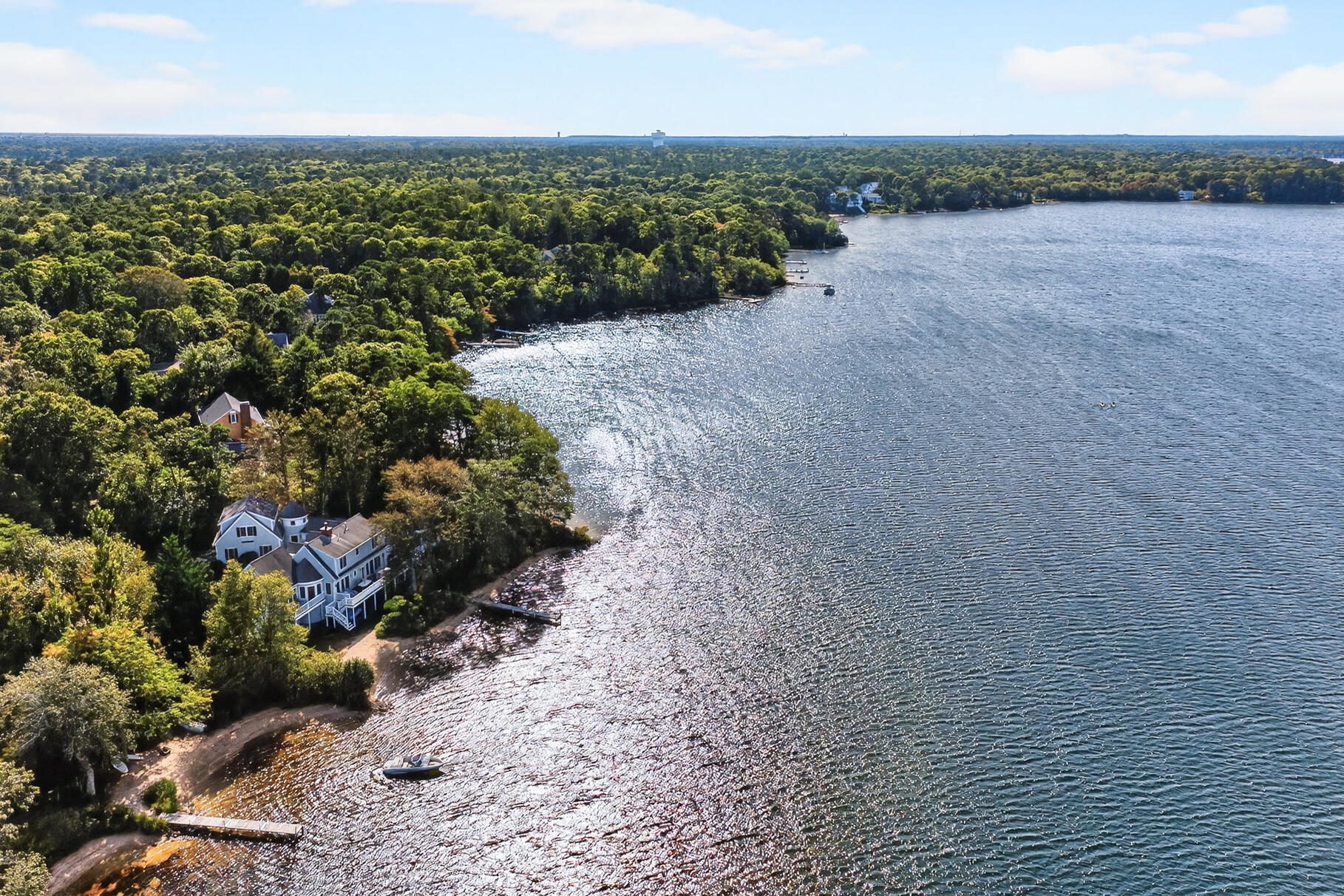 10 Brian Way Harwich, MA 02645 - Photo 57 of 75 a view of a lake with plants and large trees