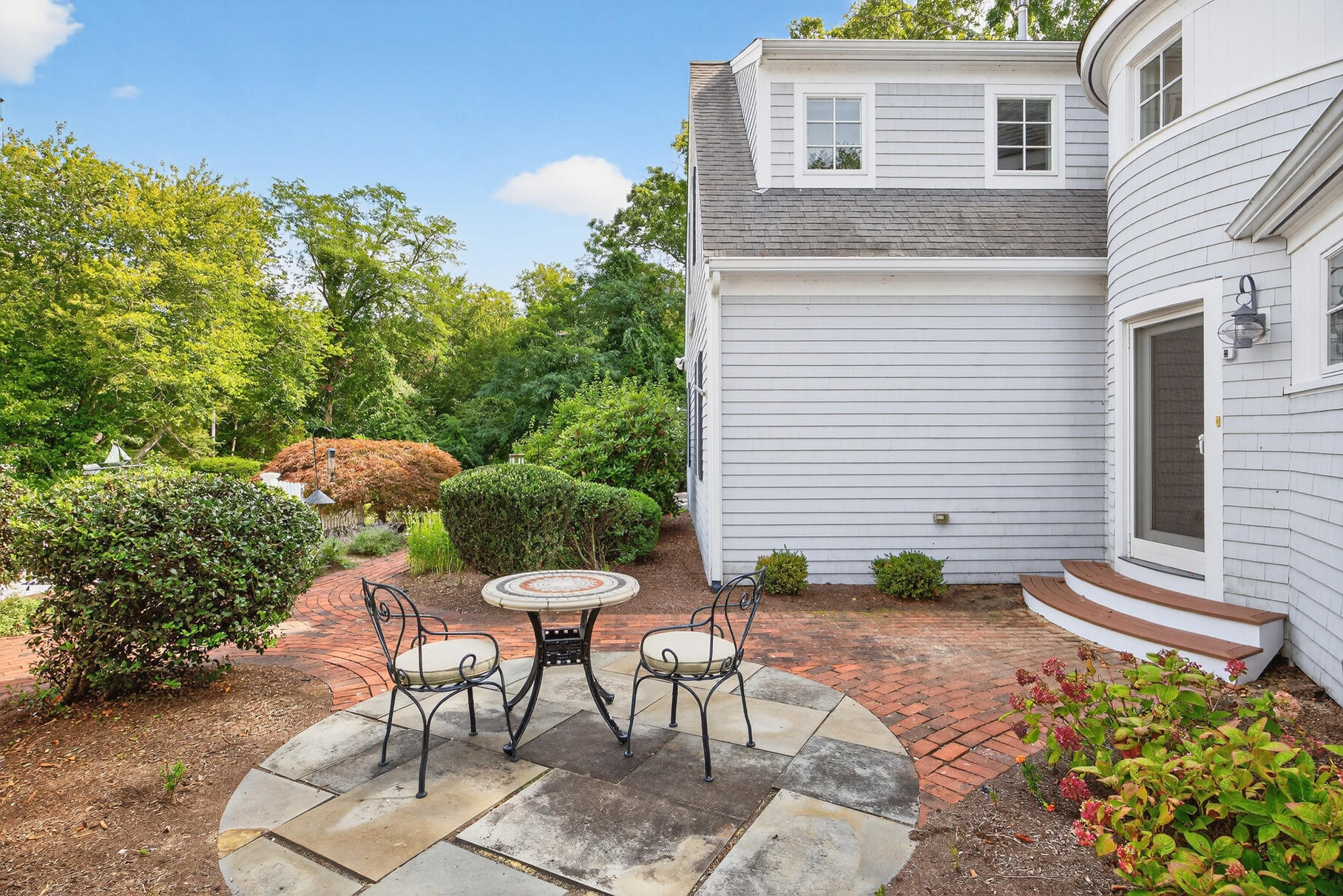 10 Brian Way Harwich, MA 02645 - Photo 67 of 75 a backyard of a house with table and chairs
