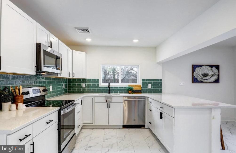 150 West Governor Road Hershey, PA 17033 - Photo 2 of 29 Modern kitchen with vibrant tile accents.