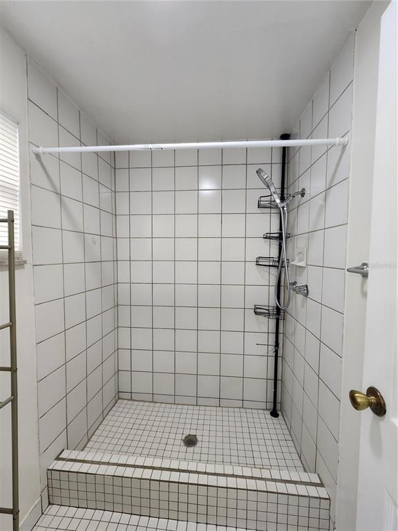 719 Southwest 75th Street, Unit 103 Gainesville, FL 32607 - Photo 11 of 28 a bathroom with a shower