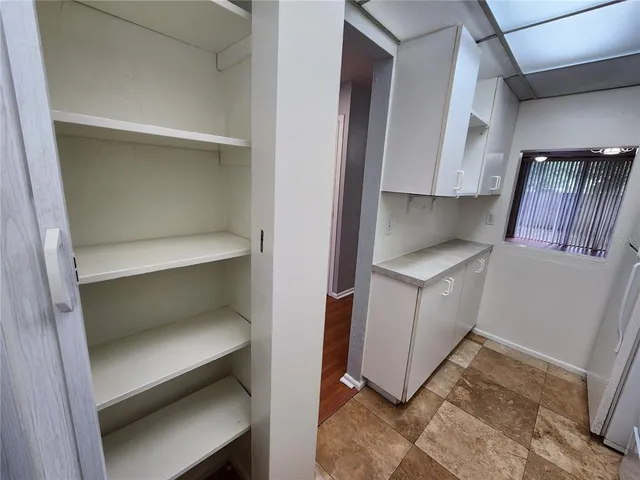 a utility room with sink dryer and washer