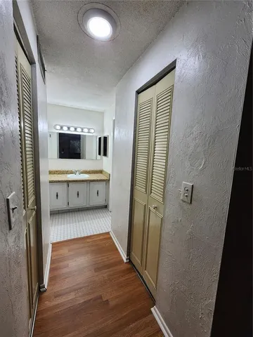 a bathroom with a double vanity sink and mirror