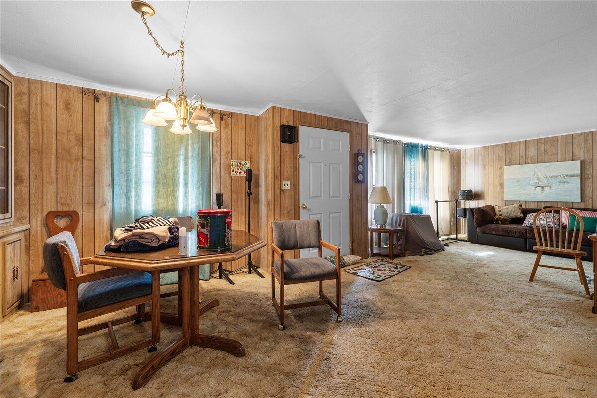 301 Freeman Road, Unit 92 Central Point, OR 97502 - Photo 5 of 16 a living room with furniture and a chandelier