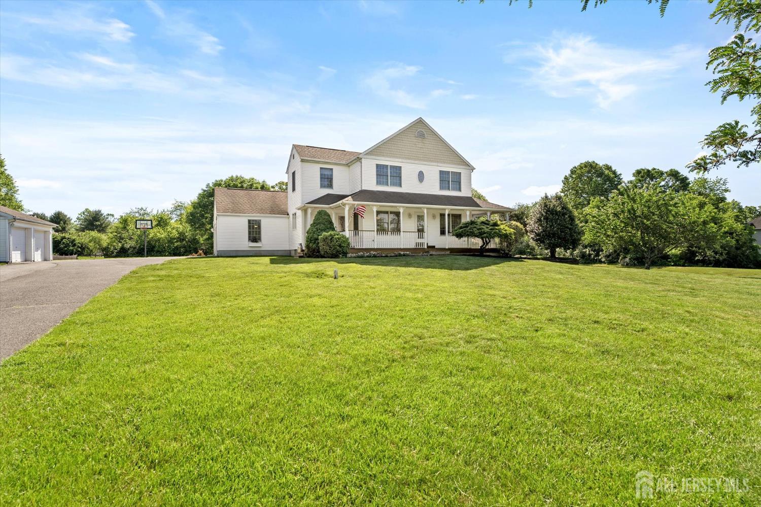 63 Iron Bridge Road Hamilton, NJ 08620 - Photo 1 of 48 a view of a house with a big yard and large trees