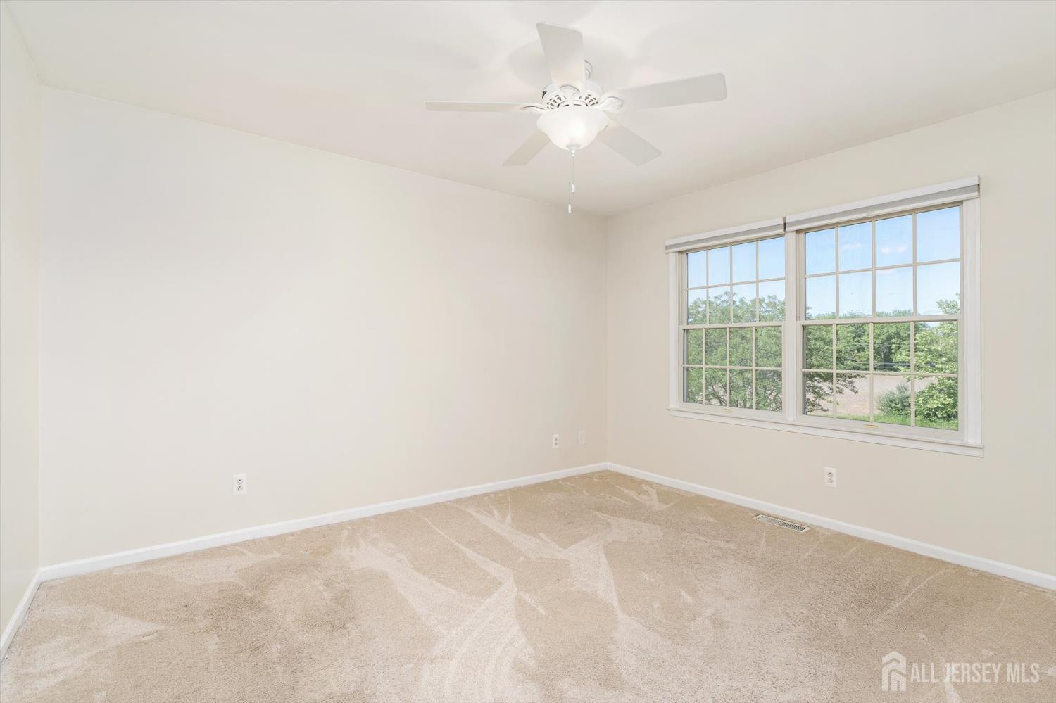 63 Iron Bridge Road Hamilton, NJ 08620 - Photo 15 of 48 an empty room with a window