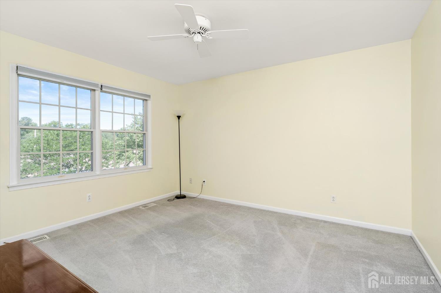 63 Iron Bridge Road Hamilton, NJ 08620 - Photo 16 of 48 a view of an empty room with a window