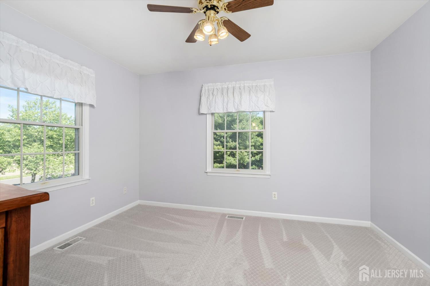 63 Iron Bridge Road Hamilton, NJ 08620 - Photo 17 of 48 an empty room with a window