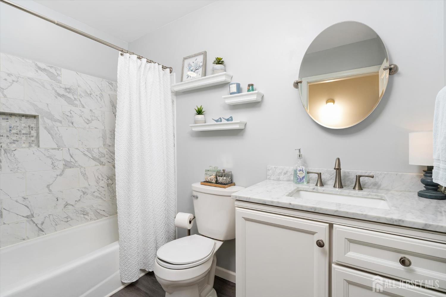 63 Iron Bridge Road Hamilton, NJ 08620 - Photo 20 of 48 a bathroom with a sink toilet and a bathtub