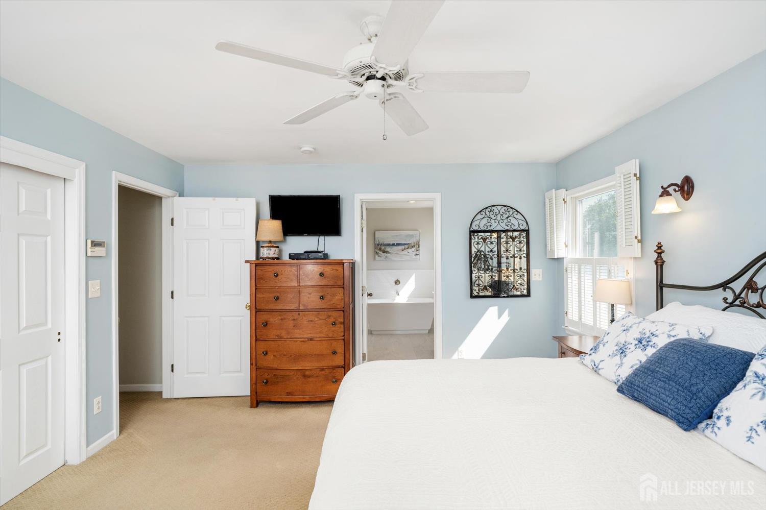 63 Iron Bridge Road Hamilton, NJ 08620 - Photo 23 of 48 a bedroom with a bed and a flat screen tv