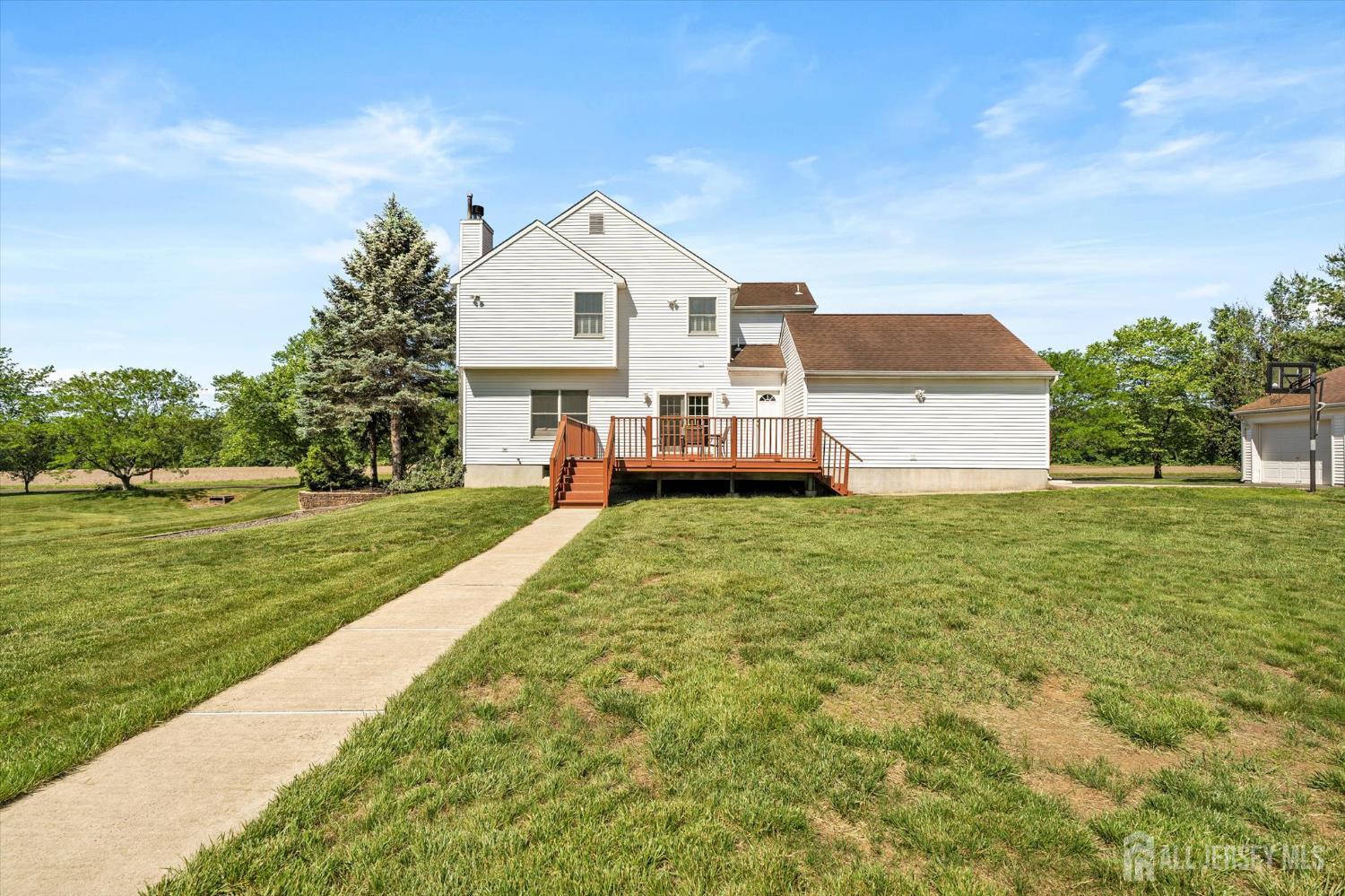 63 Iron Bridge Road Hamilton, NJ 08620 - Photo 34 of 48 a front view of a house with a yard