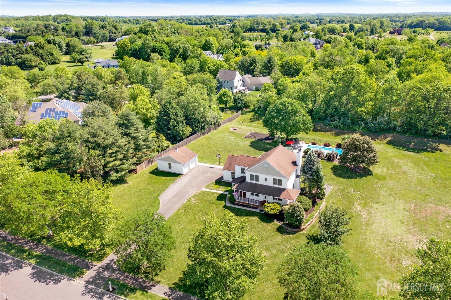 63 Iron Bridge Road Hamilton, NJ 08620 - Photo 40 of 48 an aerial view of a house with a yard