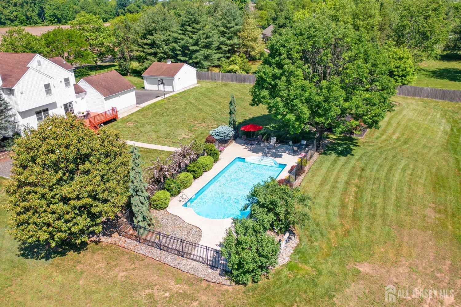 63 Iron Bridge Road Hamilton, NJ 08620 - Photo 43 of 48 an aerial view of a house with a yard and garden