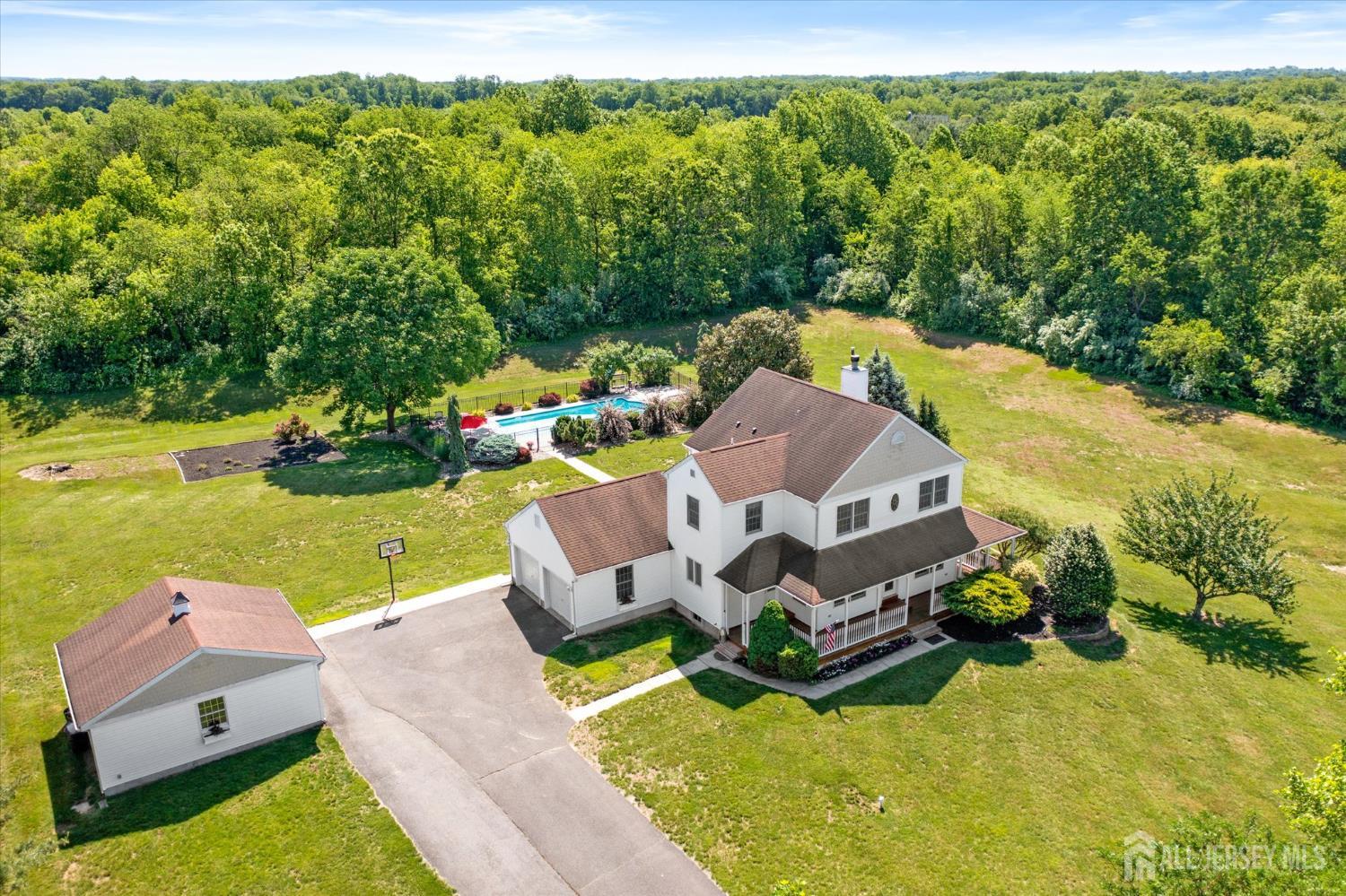 63 Iron Bridge Road Hamilton, NJ 08620 - Photo 44 of 48 an aerial view of a house with swimming pool garden and patio