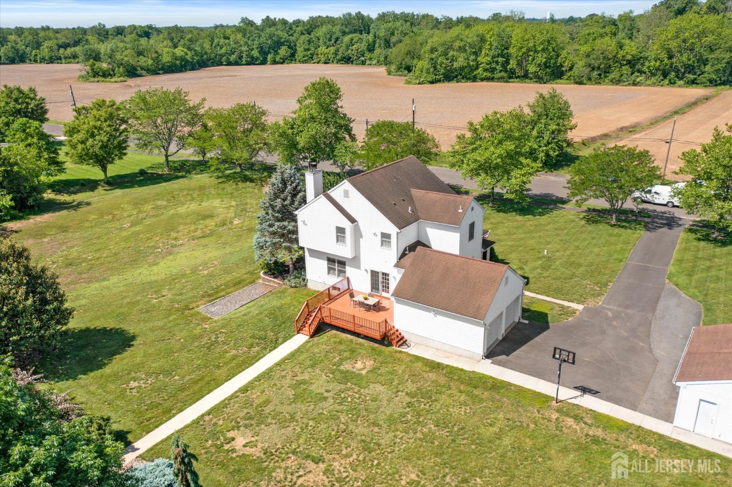 63 Iron Bridge Road Hamilton, NJ 08620 - Photo 47 of 48 an aerial view of a house with a yard and lake view