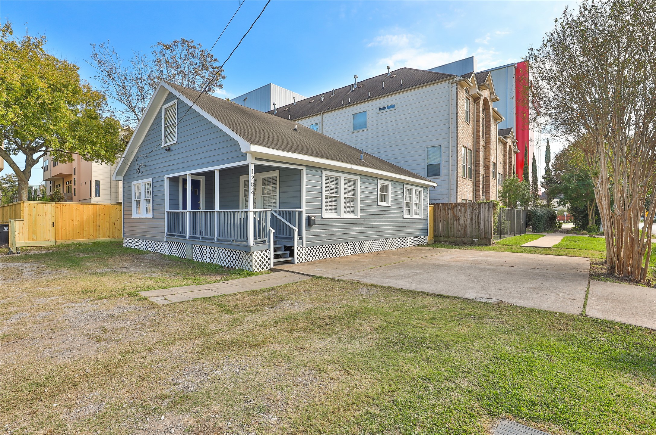1202 Birdsall Street Houston, TX 77007 - Photo 1 of 30 a view of a house with a yard and garage