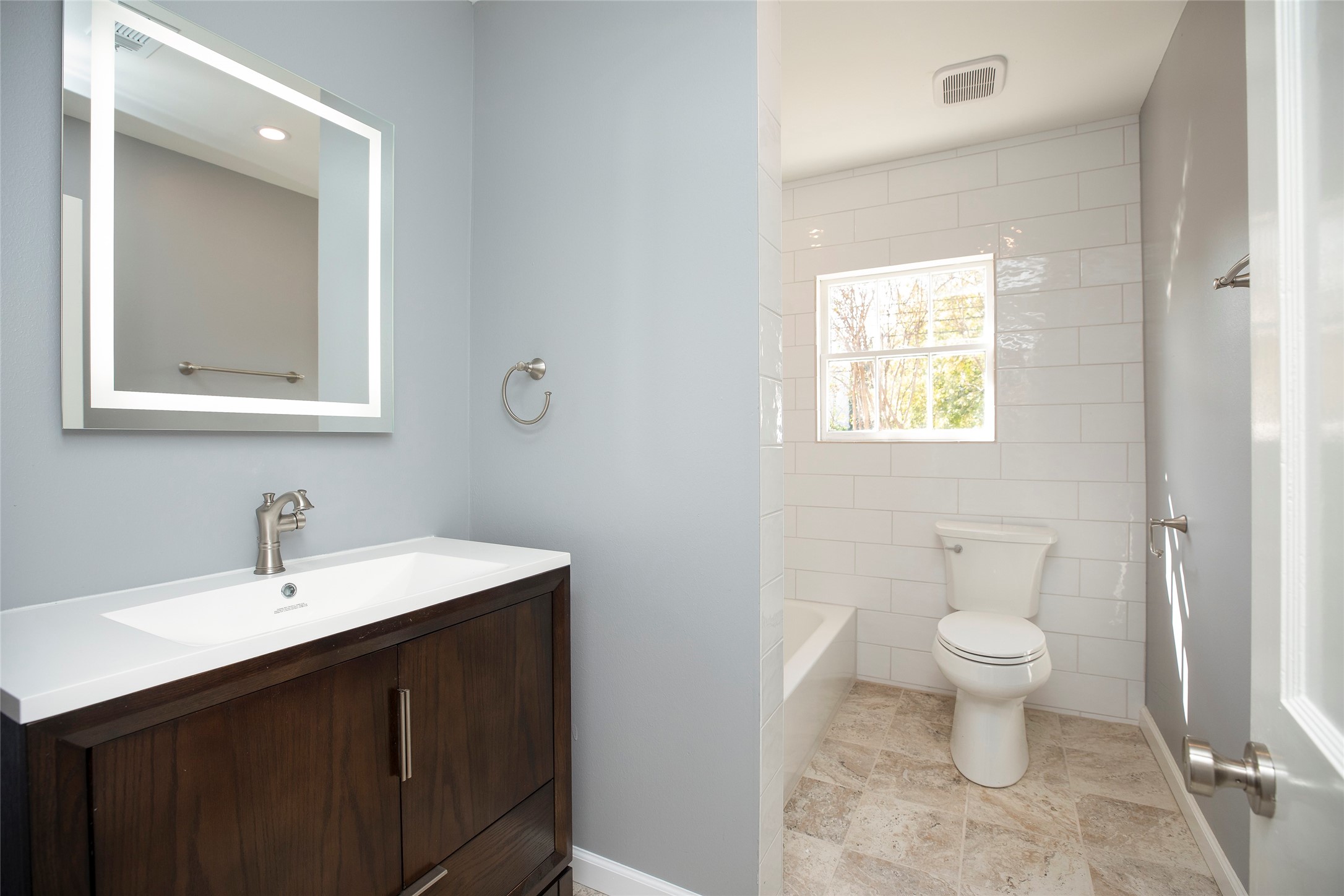 1202 Birdsall Street Houston, TX 77007 - Photo 17 of 30 a bathroom with a sink a toilet and a mirror
