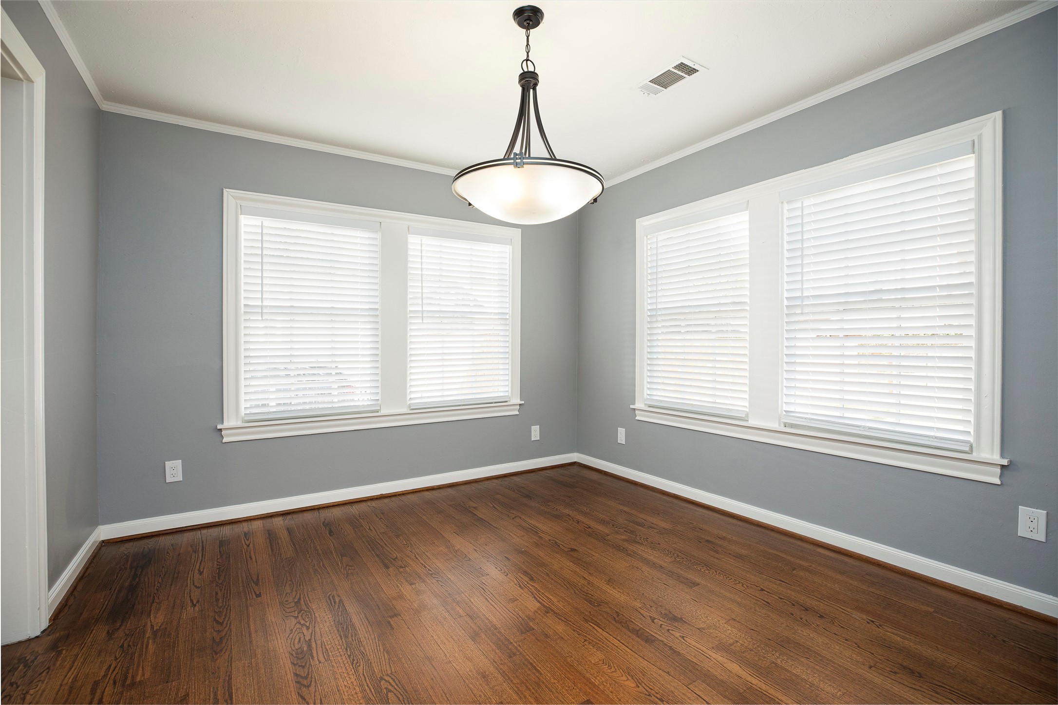 1202 Birdsall Street Houston, TX 77007 - Photo 7 of 30 a view of an empty room with wooden floor and a window