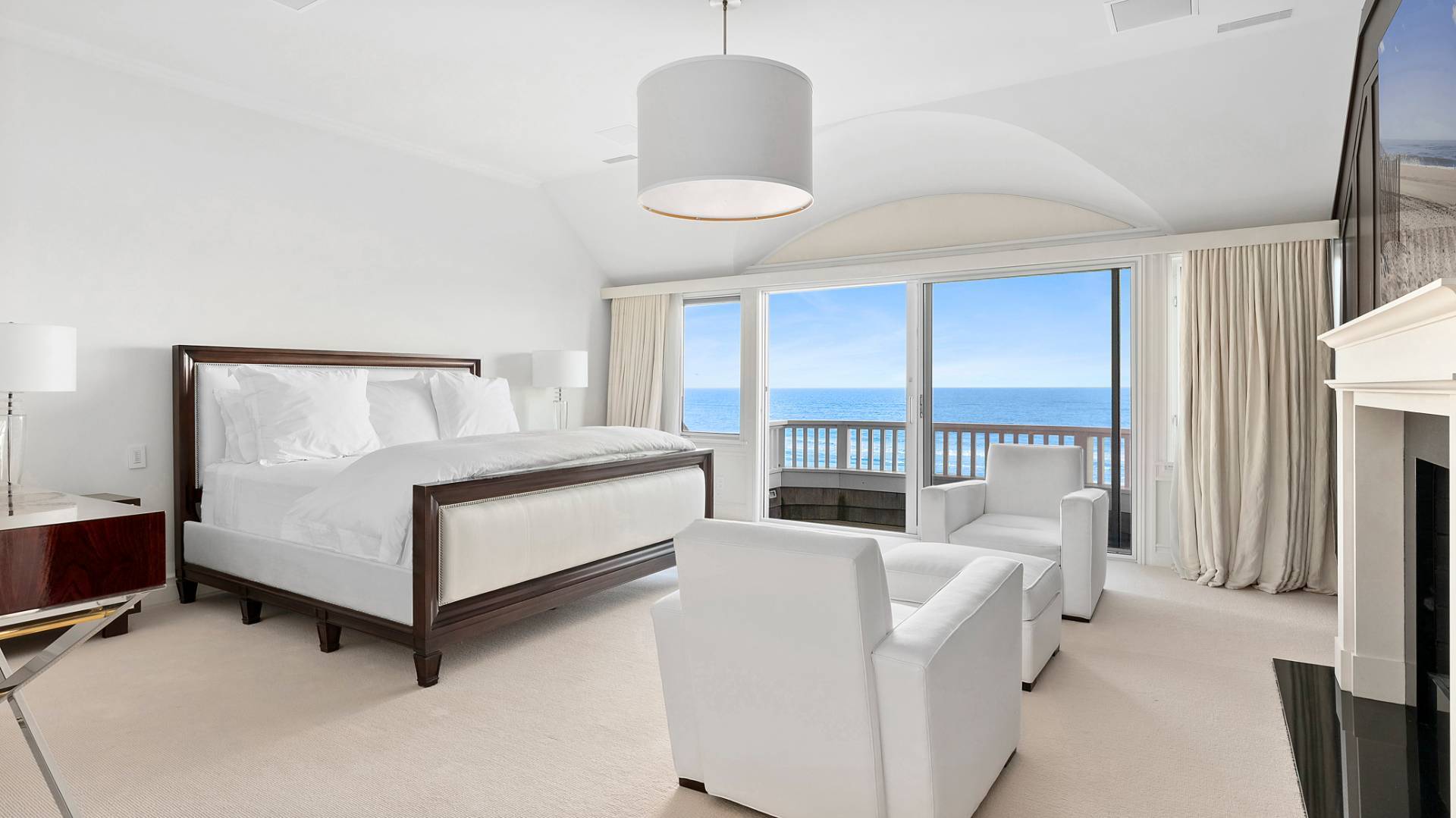 21 Surfside Drive Bridgehampton, NY 11932 - Photo 14 of 25 a bedroom with furniture and a large window