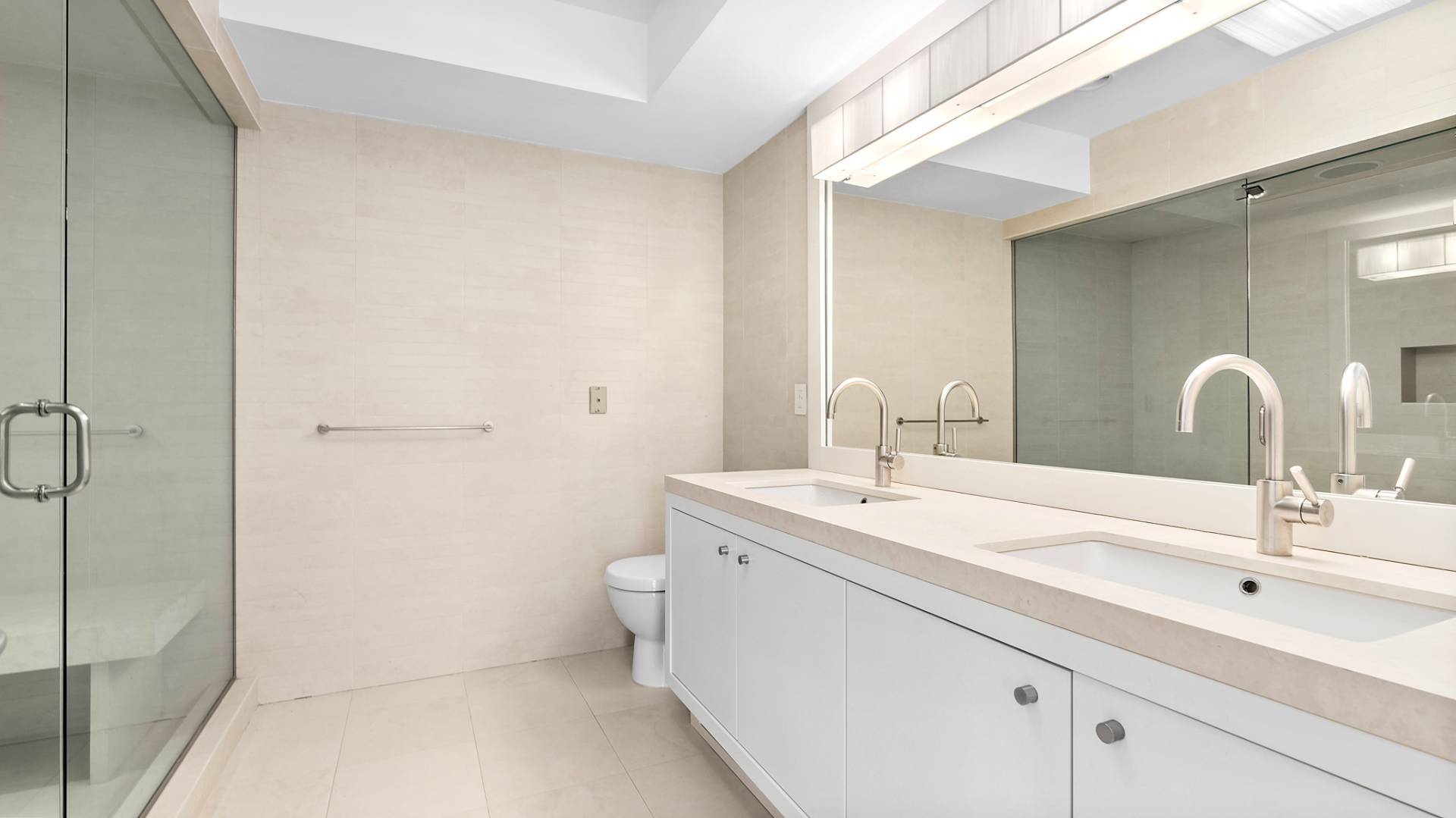 21 Surfside Drive Bridgehampton, NY 11932 - Photo 20 of 25 a bathroom with a sink and a mirror