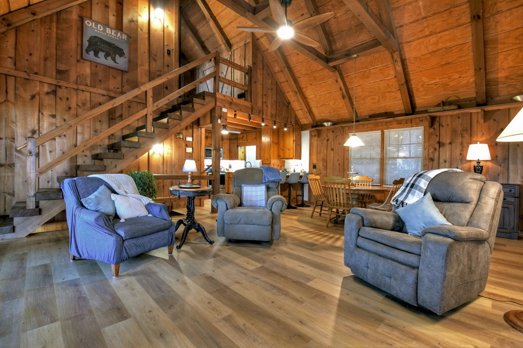 392 Eagles Nest Mountain Road Blue Ridge, GA 30513 - Photo 13 of 51 a living room with furniture and a chandelier