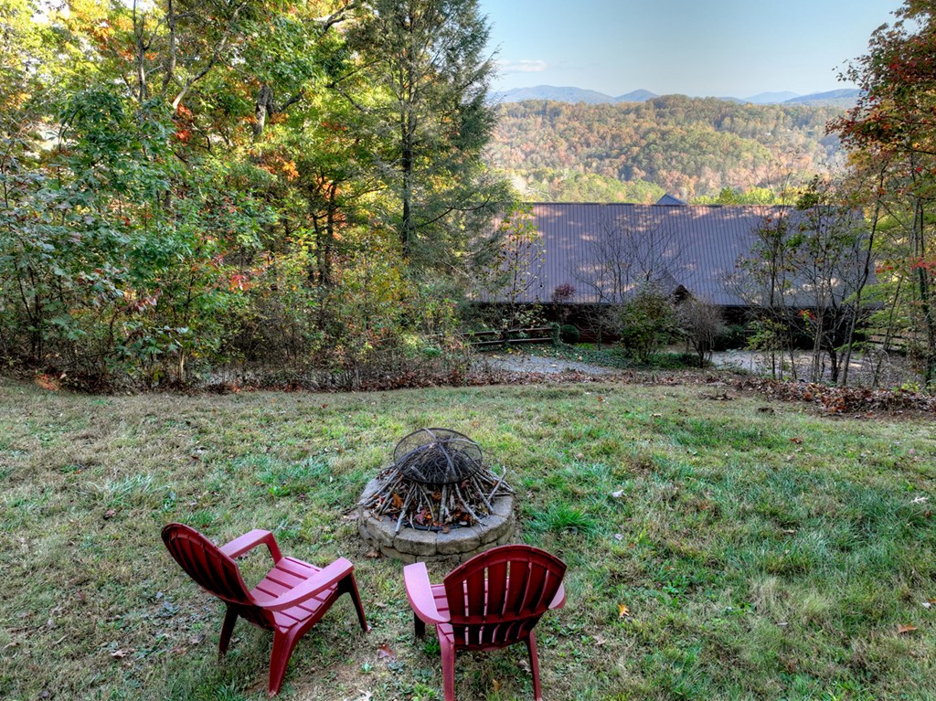 392 Eagles Nest Mountain Road Blue Ridge, GA 30513 - Photo 37 of 51 a view of a chairs in a backyard