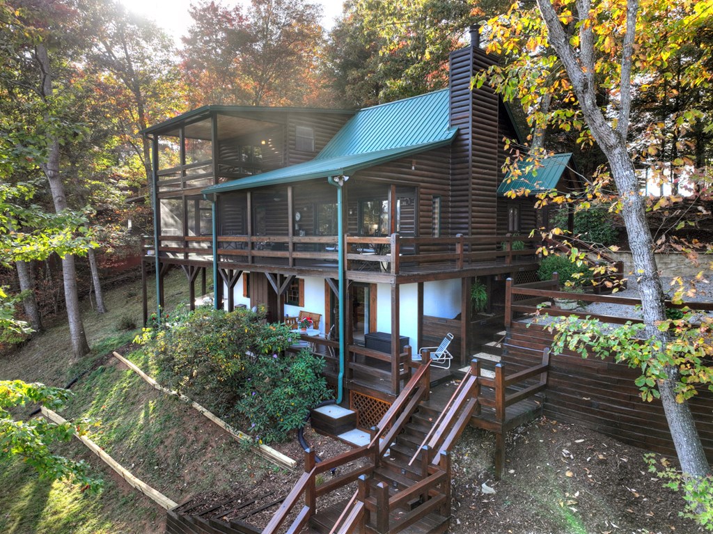 392 Eagles Nest Mountain Road Blue Ridge, GA 30513 - Photo 45 of 51 a view of house with a chairs in patio