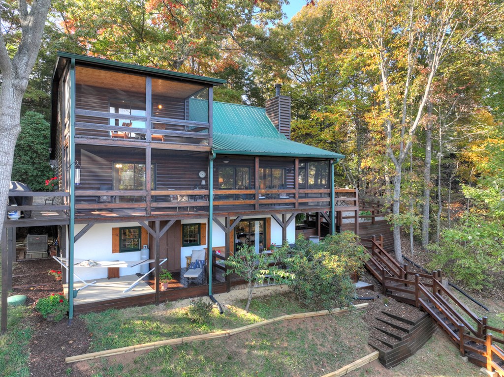 392 Eagles Nest Mountain Road Blue Ridge, GA 30513 - Photo 46 of 51 a front view of a house with garden