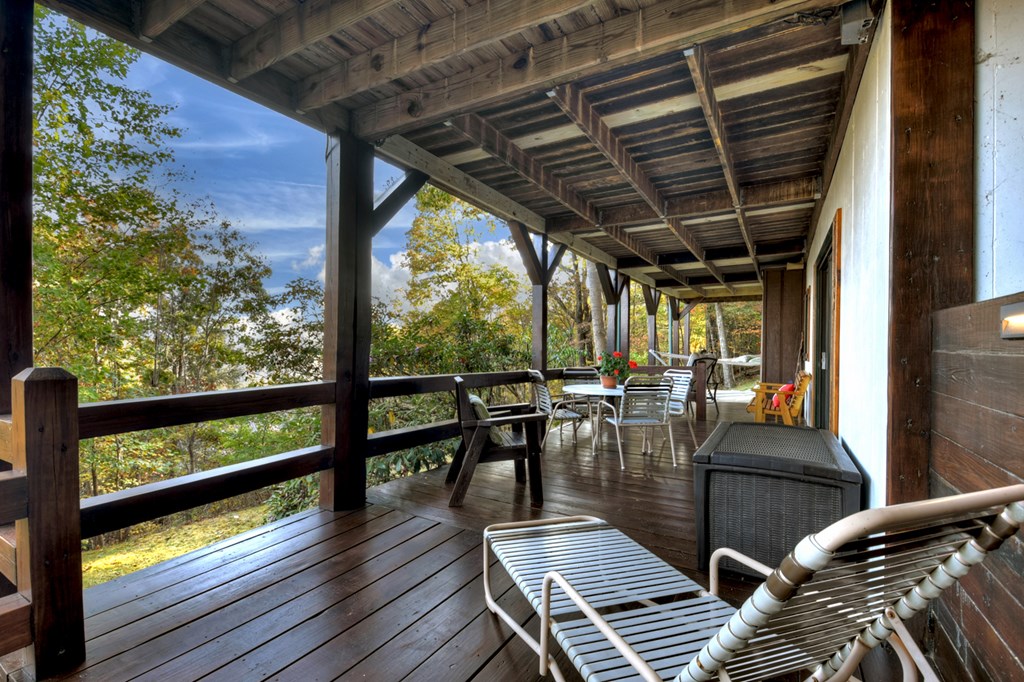 392 Eagles Nest Mountain Road Blue Ridge, GA 30513 - Photo 6 of 51 a view of a chairs and table in the balcony