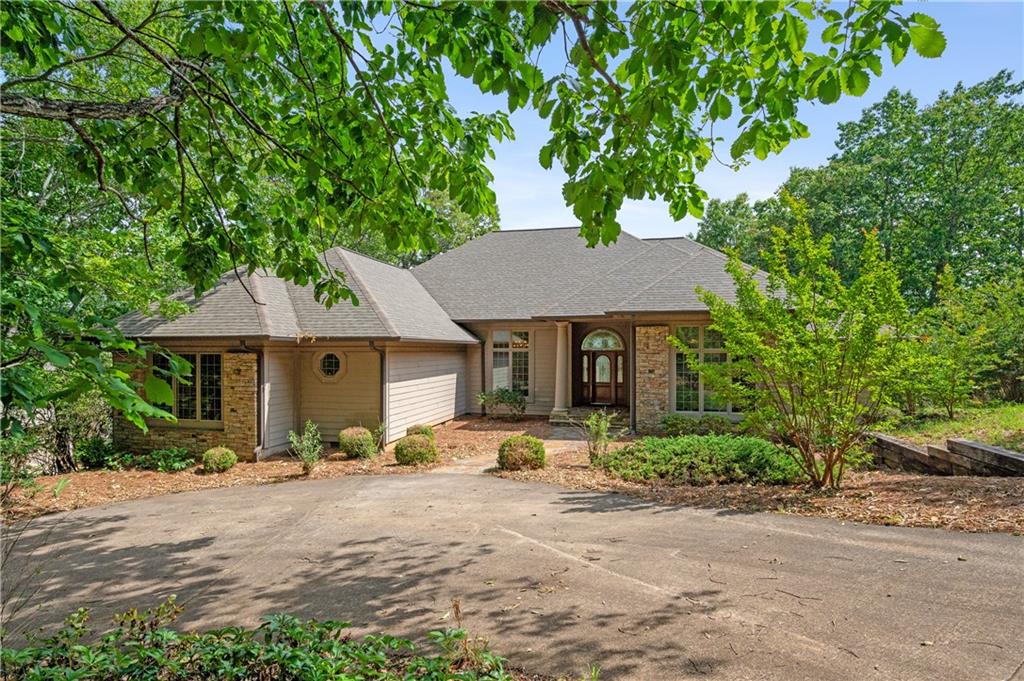 a front view of a house with garden