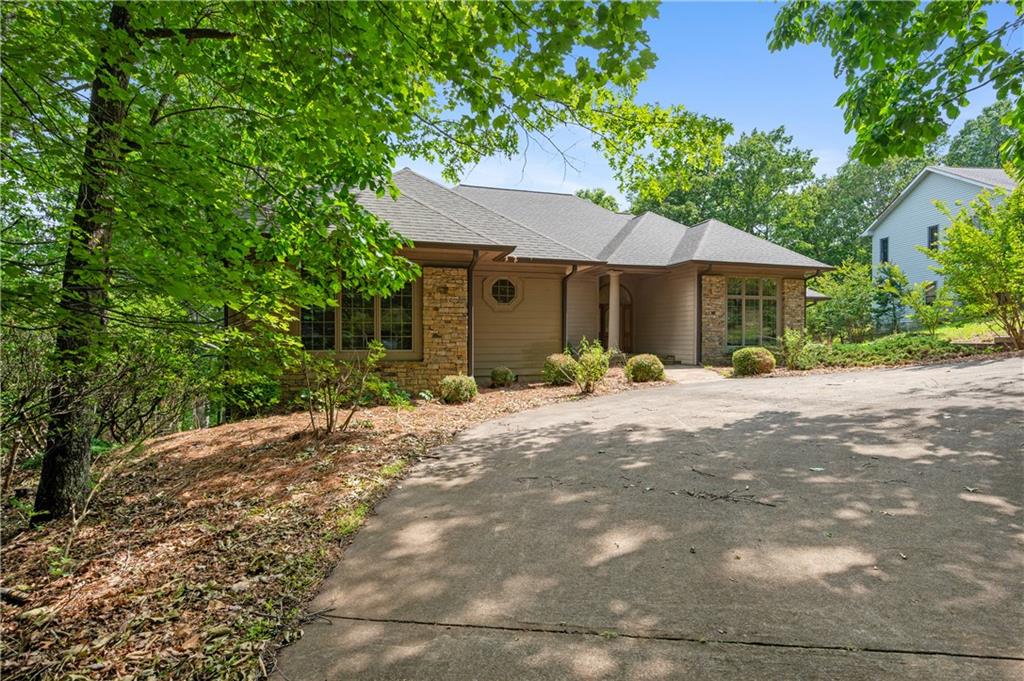 267 Starcross Lane Jasper, GA 30143 - Photo 11 of 46 a front view of a house with a garden
