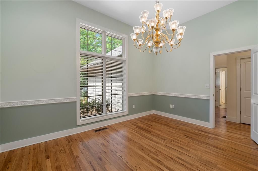 267 Starcross Lane Jasper, GA 30143 - Photo 15 of 46 a view of an empty room with wooden floor and a window