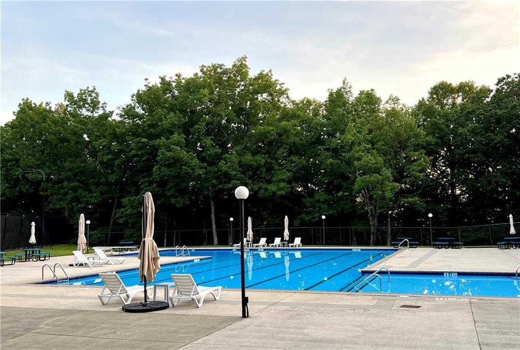 267 Starcross Lane Jasper, GA 30143 - Photo 16 of 46 a view of a swimming pool with a lounge chair
