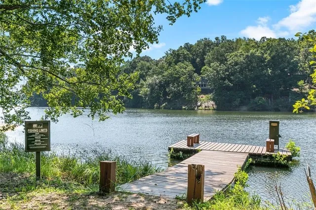 a view of a lake with green space