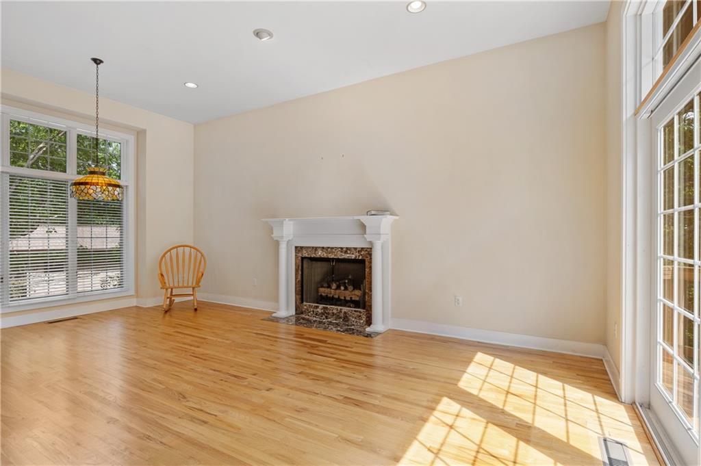 267 Starcross Lane Jasper, GA 30143 - Photo 22 of 46 a view of a livingroom with a fireplace and wooden floor