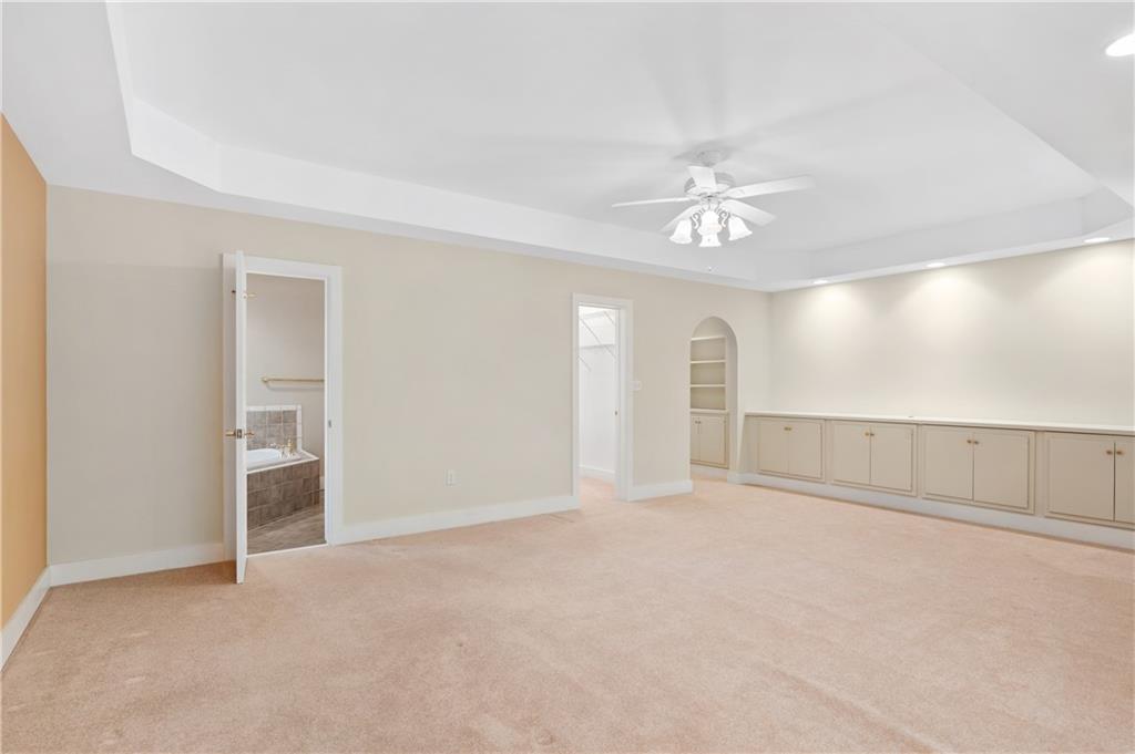 267 Starcross Lane Jasper, GA 30143 - Photo 34 of 46 an empty room with chandelier fan and windows