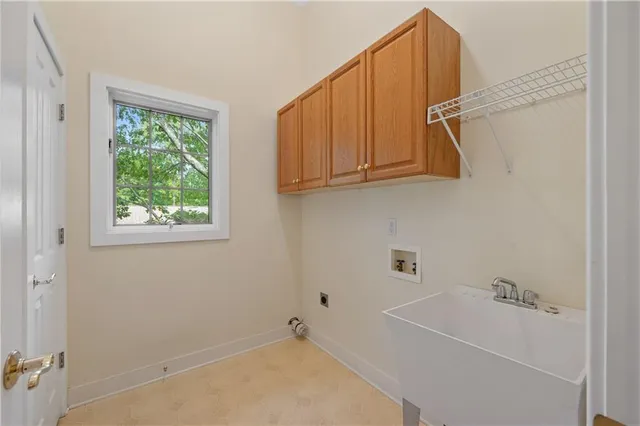 a bathroom with a bathtub and a window