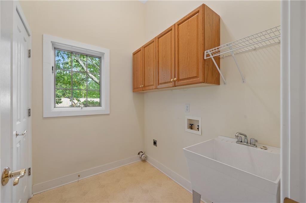 267 Starcross Lane Jasper, GA 30143 - Photo 37 of 46 a bathroom with a bathtub and a window