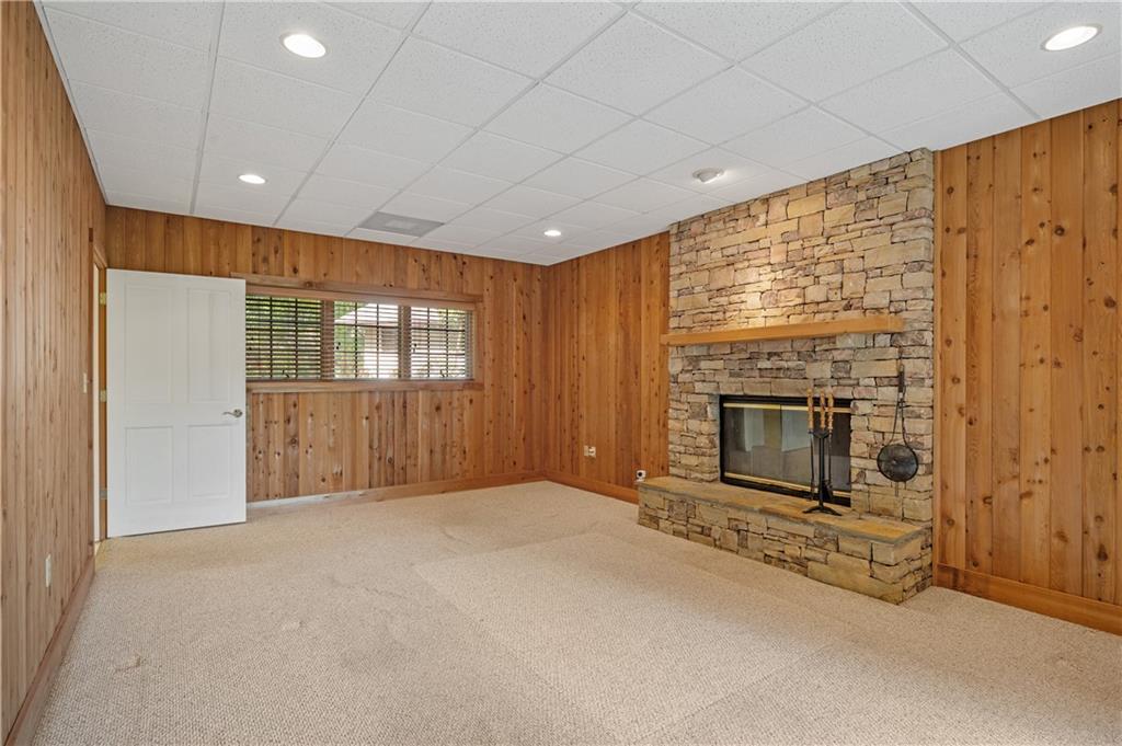267 Starcross Lane Jasper, GA 30143 - Photo 38 of 46 a view of an empty room with a fireplace and a window
