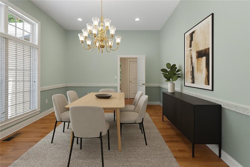 267 Starcross Lane Jasper, GA 30143 - Photo 4 of 46 a dining room with chandelier and wooden floor