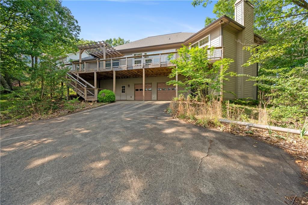 267 Starcross Lane Jasper, GA 30143 - Photo 42 of 46 a front view of a house with a garden