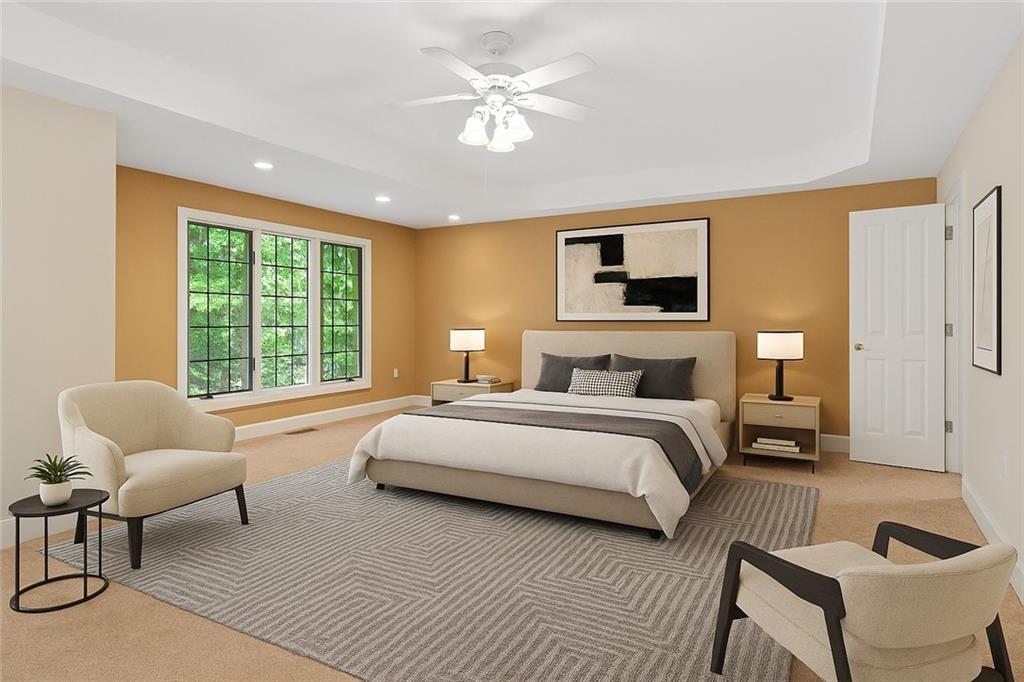 267 Starcross Lane Jasper, GA 30143 - Photo 9 of 46 a spacious bedroom with a bed and a couch