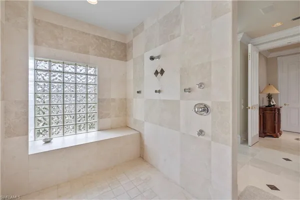 a bathroom with a bathtub and a shower