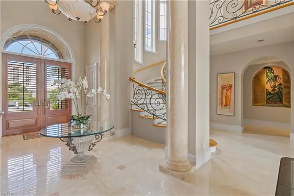 a view of hall way with furniture