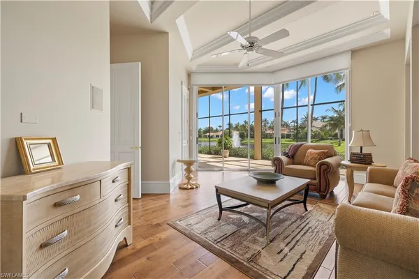 a living room with furniture and large window