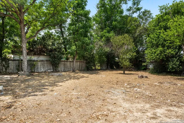 a house with trees in front of it