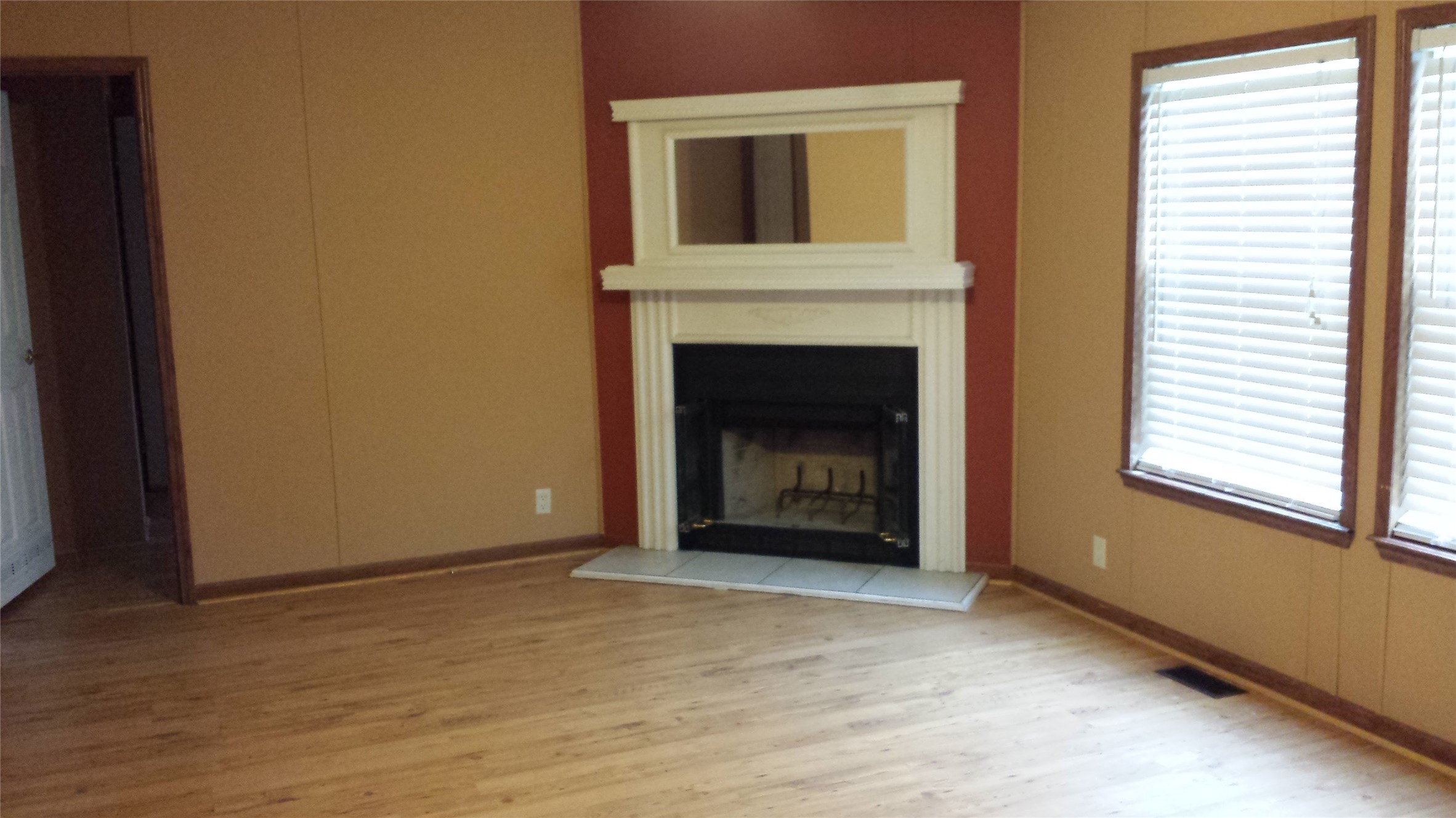 270 Country Way Road Smithville, TX 78957 - Photo 19 of 24 a view of an empty room with a fireplace and a window