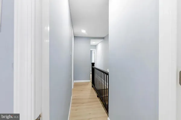 a view of a hallway with a dining room