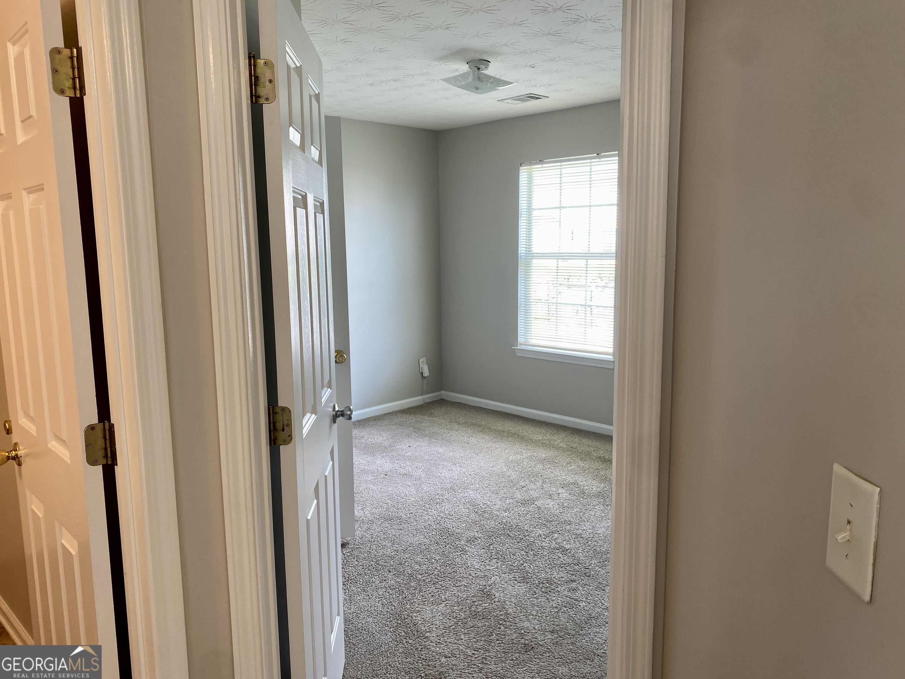 456 Parkside Way McDonough, GA 30253 - Photo 11 of 14 a view of an empty room with a window